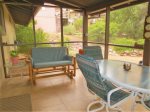 Enclosed, Screened Patio with Seating and Table